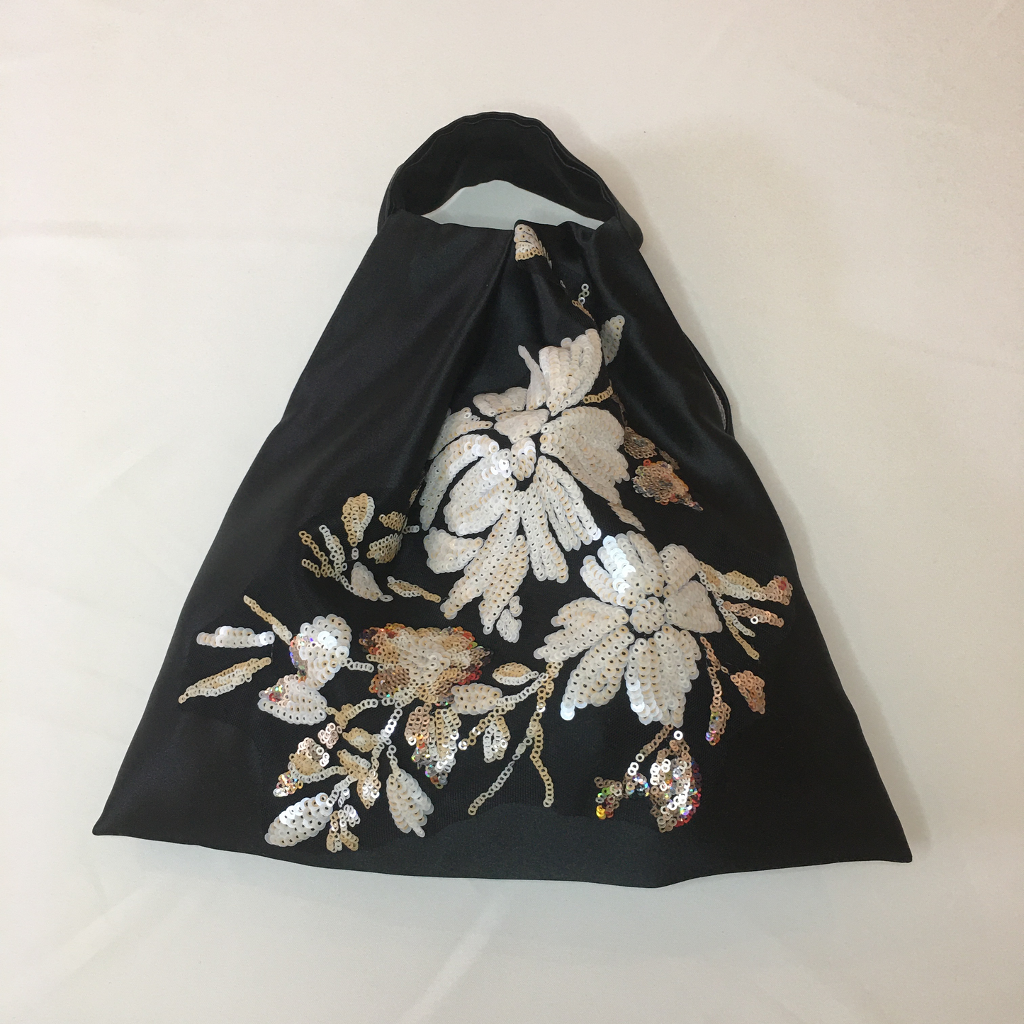 Satin bag with sequin appliqué