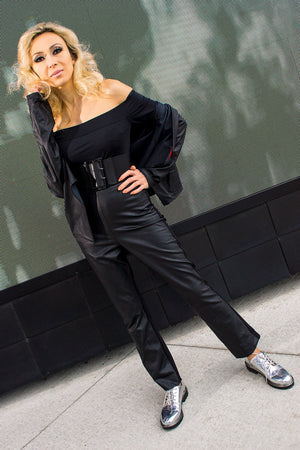 Model wears black poly Grace Kelly bodysuit with black leatherette Fine Faye jacket and matching Kissin' Pants. Model: Avan Aman, Photo: Michael Scott