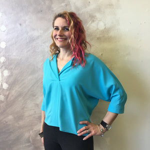 Bella blouse, turquoise (no longer available.) Model wears size M and is 5'5"  tall