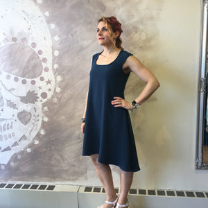 Lisbeth dress in teal. Model wears a S but has a medium hip. She is 5'5" tall