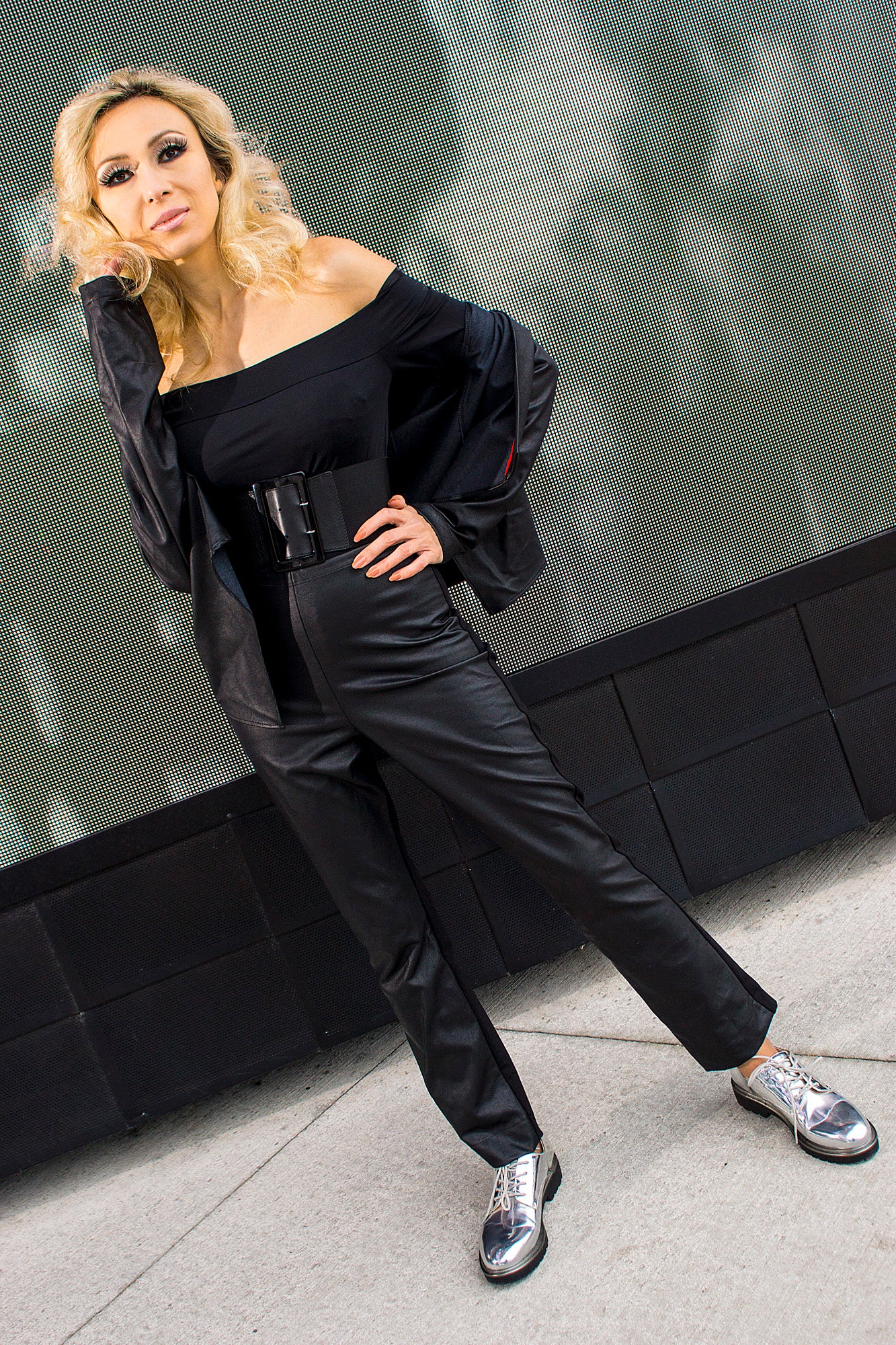 Model wears black poly Grace Kelly bodysuit with black leatherette Fine Faye jacket and matching Kissin' Pants. Model: Avan Aman, Photo: Michael Scott