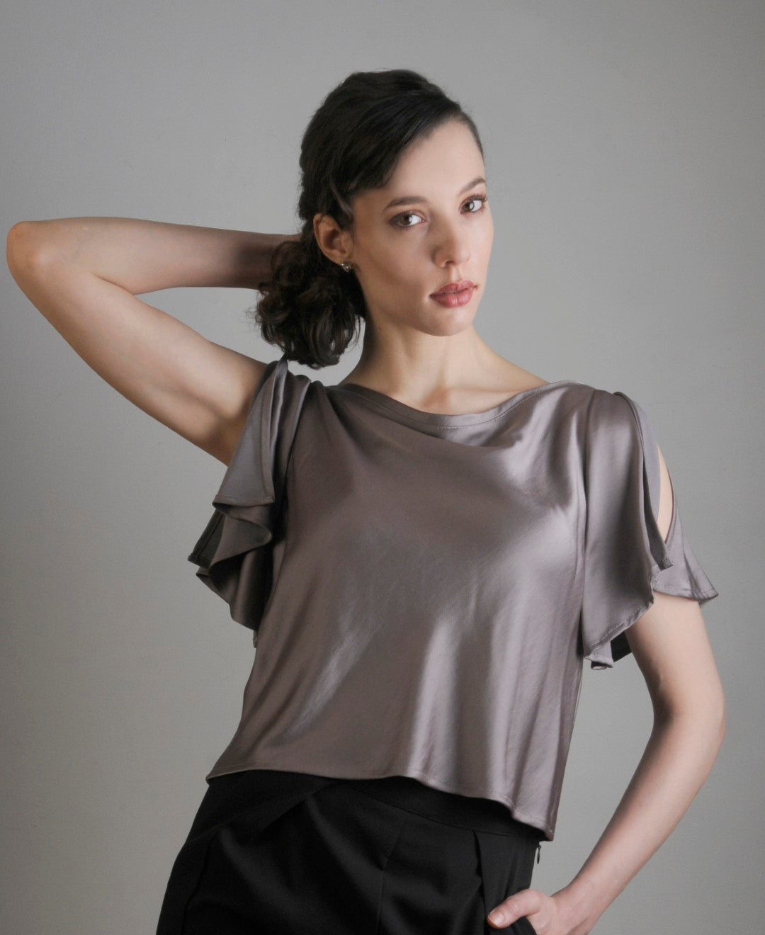 Flutter top in satin. Model wears XS and is 5’11” tall