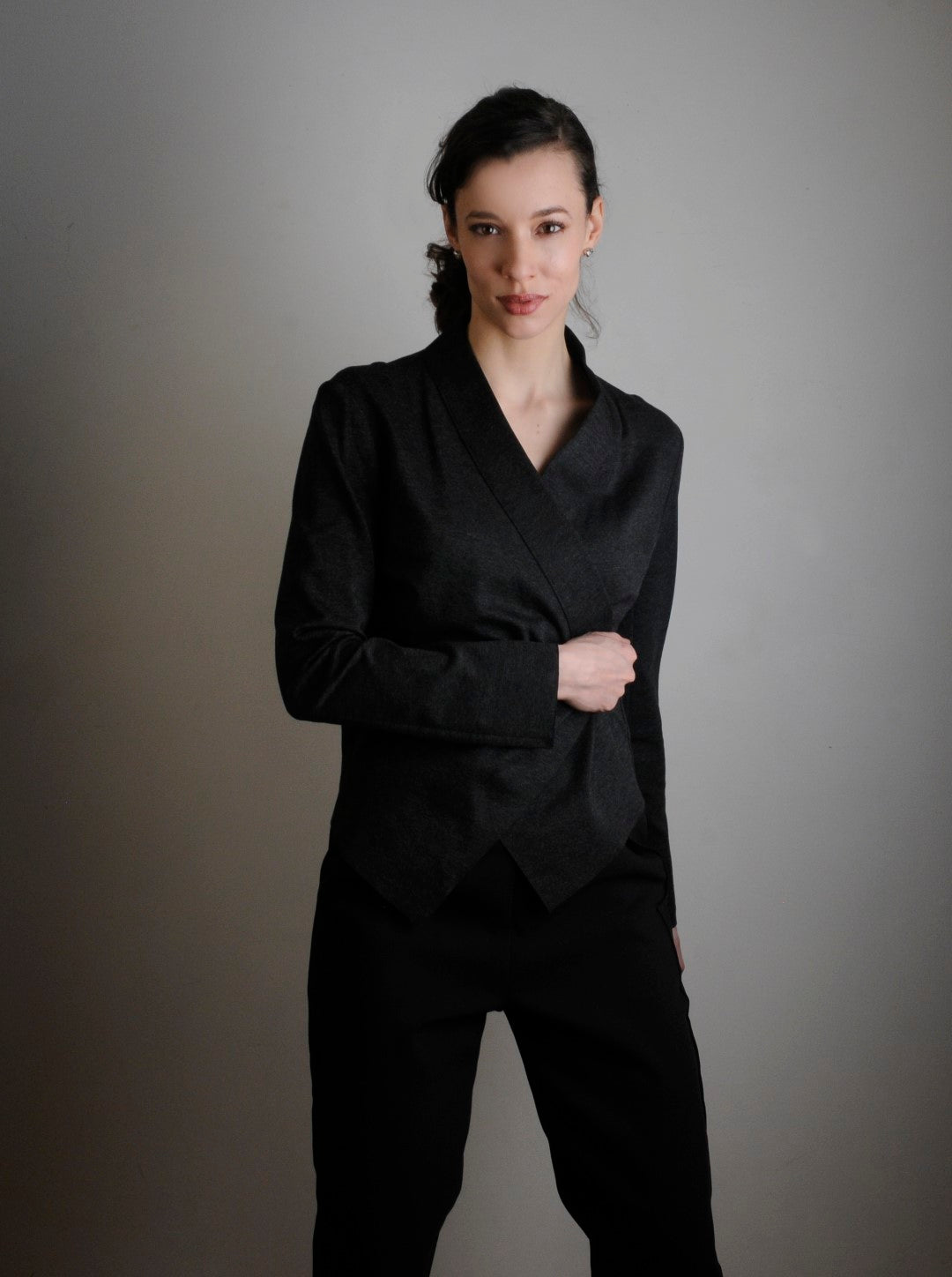 Charcoal Faye Sweater Jacket. Model wears XS and is 5'11" tall. She is wearing Tucks pant in black.